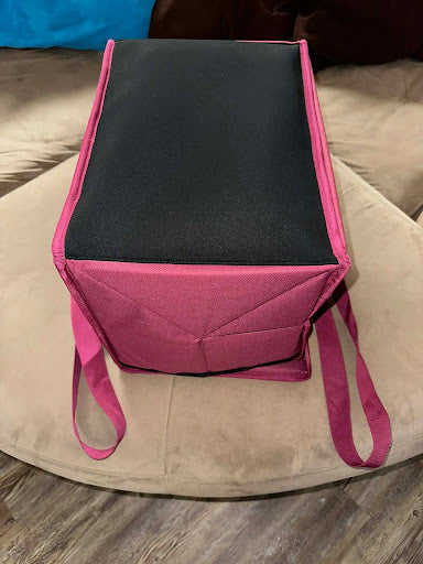 showing patented weighted base of The upright insulated food delivery bag