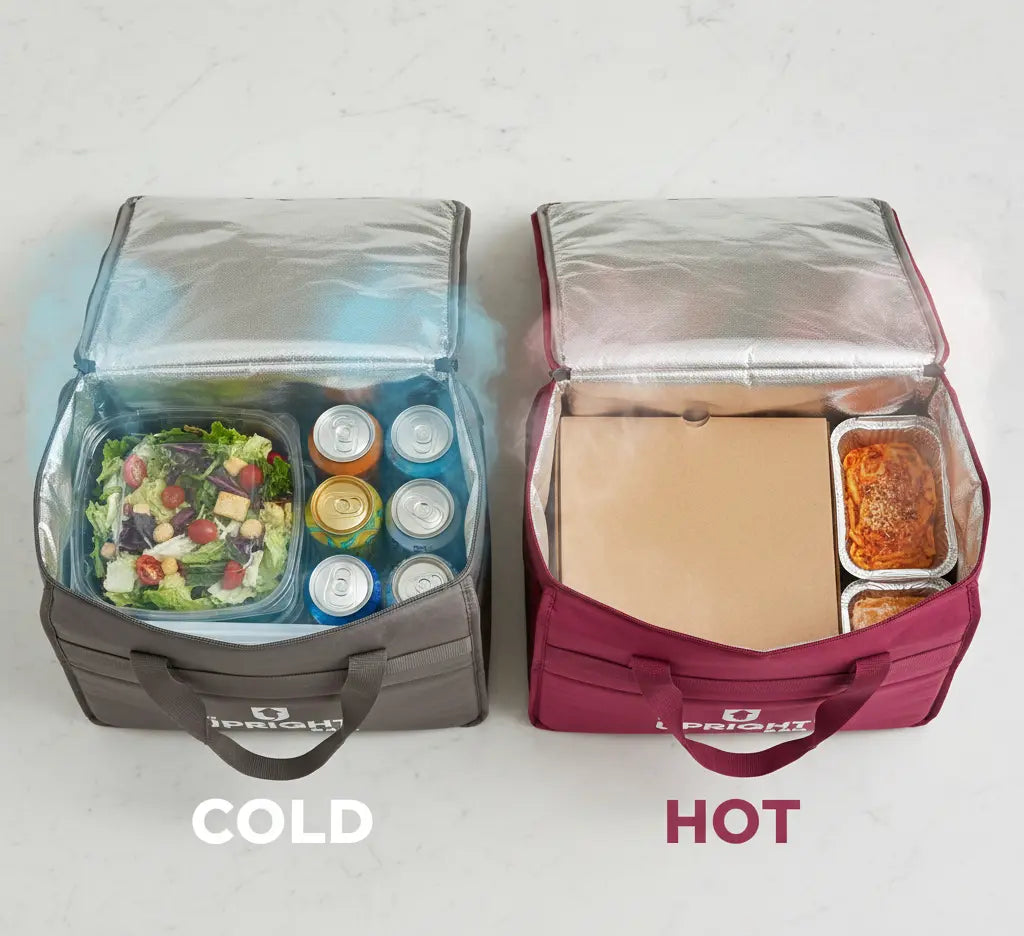 Two insulated delivery bags, one labeled 'Cold' with a salad and drinks, the other labeled 'Hot' with a sandwich and soup.