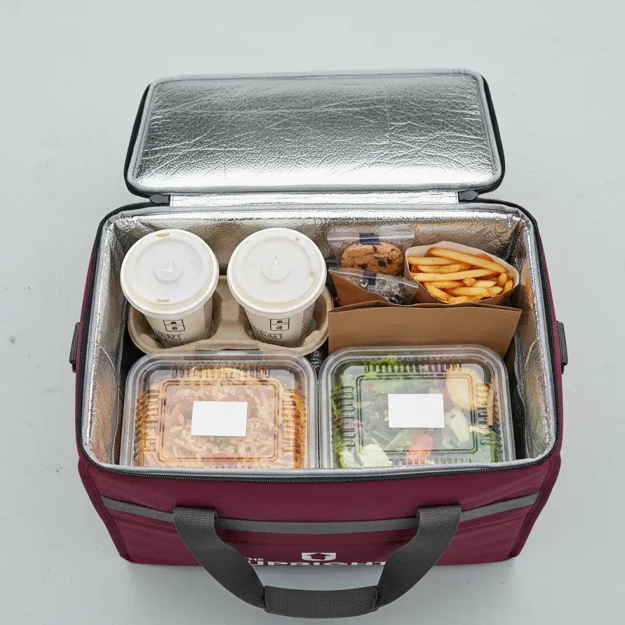 Insulated food delivery bag with food items